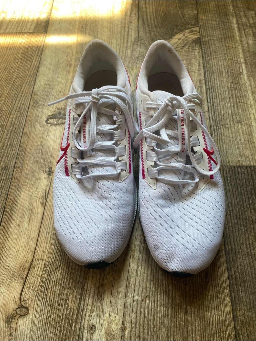 Nike White Running Shoes with Pink Swoosh